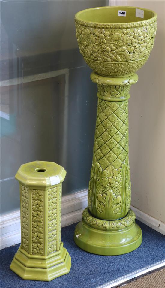 A Burmantofts green jardiniere on plinth and one other plinth